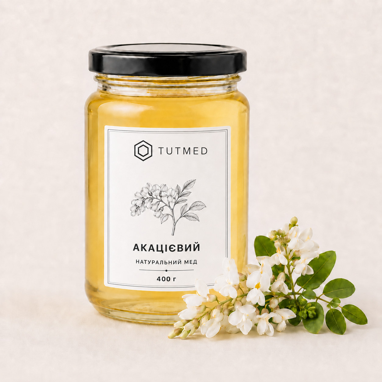 Акацієвий мед у скляній банці